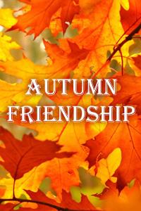 A close view of several autumn leaves on a branch.