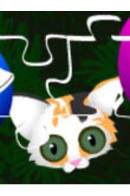 The viewer is looking down at a calico kitten. The kitten looks up at us with wide green eyes.