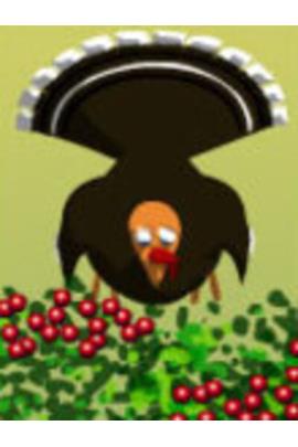 A turkey looks down at a bush covered in berries.