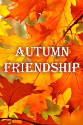 A close view of several autumn leaves on a branch.