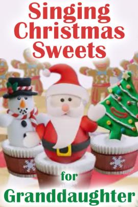  Three cupcakes with cookie decorations standing in the icing: Santa, a Christmas tree, and a snowman. There are gingerbread men in the background, and Singing Christmas Sweets for Granddaughter is written over the cupcakes. 