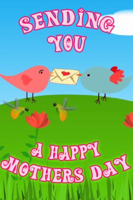 This Mother's Day ecard shows a grassy hill and blue sky with two cartoon birds on the hill facing each other. In thjeir beaks they hold an envelope with a heart on it. The title reads, "Sending You A Happy Mothers Day".