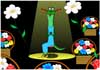 A lady lizard sits on a chair in the middle of the stage. She is surrounded by bouquets of flowers.