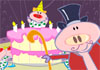 A pig wearing a polka dotted shirt, red nose, and clown wig jumps up from inside a birthday cake. 