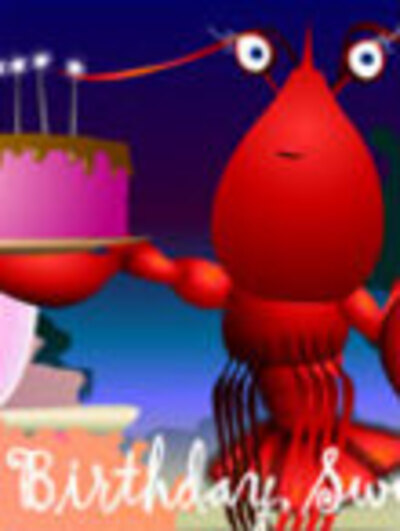 A lobster holds up a cake with sparkling birthday candles.