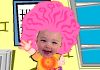 A baby with pink hair sits at a desk in an office.
