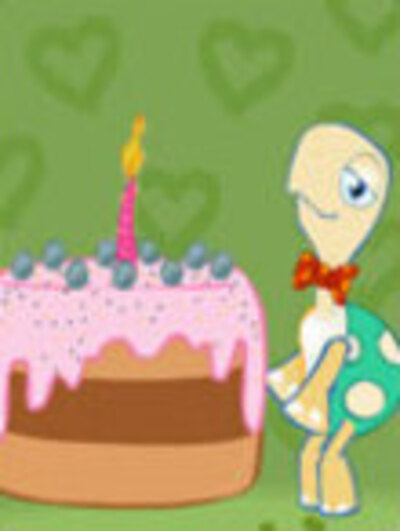 A turtle stands next to a birthday cake with a lit candle on top of it.