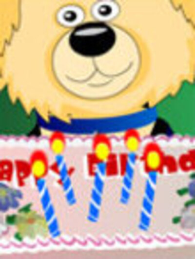 A fluffy, cheerful dog holds up a birthday cake with lit candles, and smiles at the viewer.