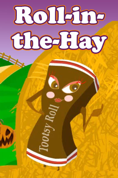 A chocolate candy roll, leaning against a haystack.