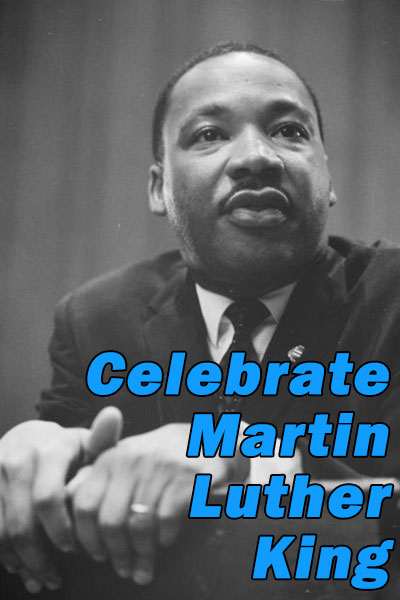 A historical black and white photo of civil rights leader, Martin Luther King Jr. He is speaking, and leaning on a podium.