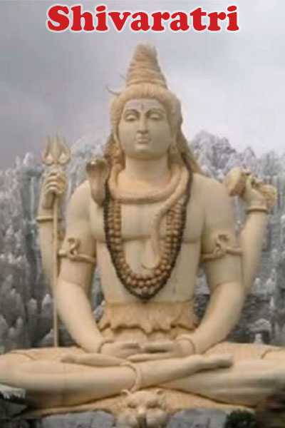 A marble statue of Shiva, sitting in the lotus pose. 
