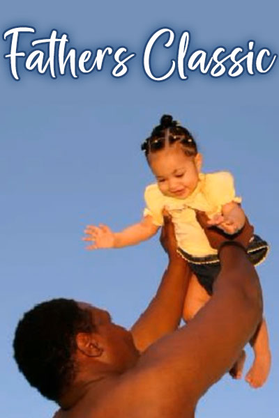 A black father lifts his child in the air, and the child smiles joyfully in this sweet Fathers Day ecard.