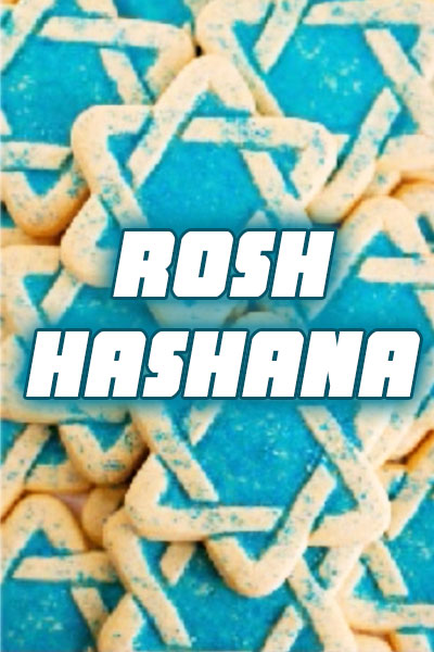 A pile of Star of David shaped sugar cookies, sprinkled with blue sugar to enhance the lines of the stars.