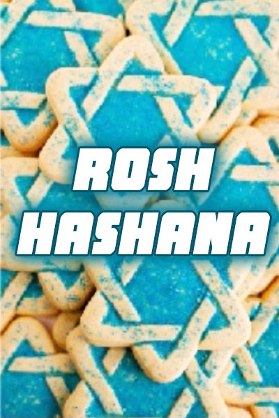 A pile of Star of David shaped sugar cookies, sprinkled with blue sugar to enhance the lines of the stars.