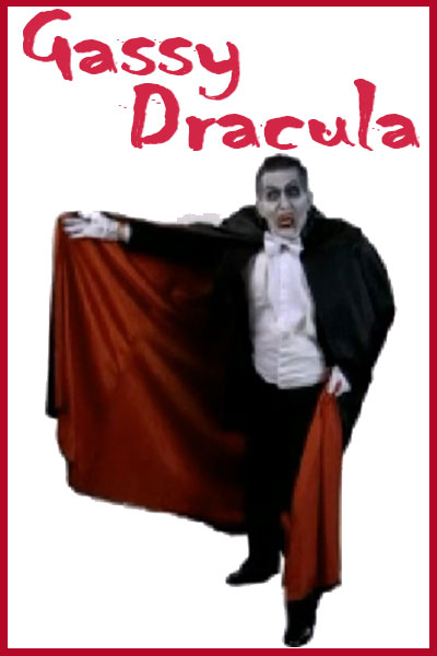 A man in a traditional vampire costume: a black suit, white shirt, and long red and black cape.
