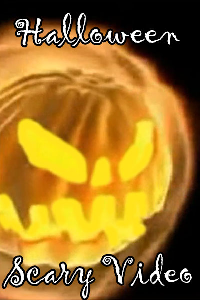 A jack o' lantern with a scary face carved into it.