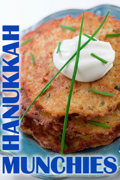 A latke with a dollop of sour cream on top of it.