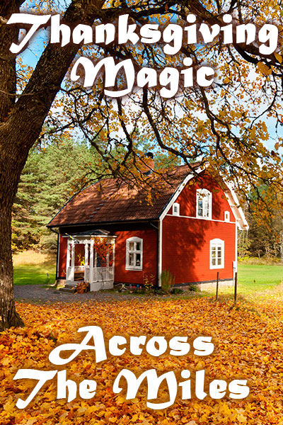 A quaint farmhouse in the middle of a field with lots of autumn leaves on the ground.