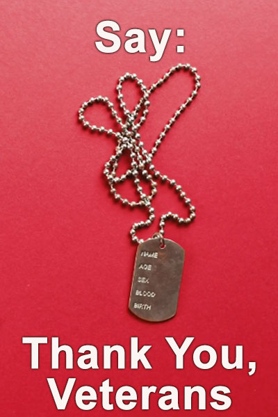 A plain red background, with a single dog tag on a chain lying upon it.