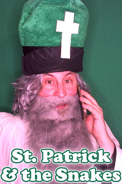 St. Patrick & the Snakes ecard's image shows Saint Patrick with long gray hair and a gray beard in a green miter and white robe. The miter has a white cross on it. The background is green. St. Patrick is on a cell phone. The Title in white font reads, "St. Patrick & the Snakes".