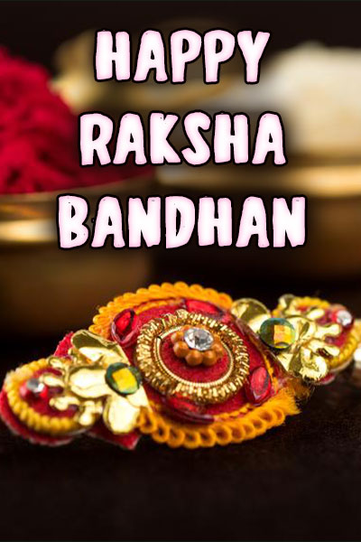 An intricately crafted, beaded Rakhi bracelet in hues of reds, golds, and greens.