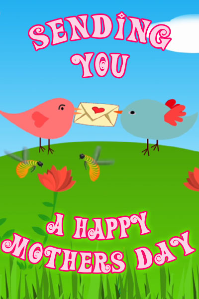 This Mother's Day ecard shows a grassy hill and blue sky with two cartoon birds on the hill facing each other. In thjeir beaks they hold an envelope with a heart on it. The title reads, "Sending You A Happy Mothers Day".