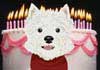 A white, West Highland terrier dog wearing a red bandanna. A line of lit birthday candles are in the background.