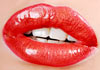 A closeup for a pair of glossy, red lips.
