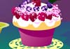 A tiny, softly glowing fairy flies above a beautifully decorated cupcake with a single candle in it, and a bowl of berries. The title of this beautiful birthday ecard Birthday Cupcake Surprise is above her.