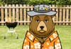 A huge bear. He's dressed in a Hawaiian shirt, and a bucket hat with fishing lures attached to it.