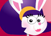 A bunny in a purple dress. She has a cute, short hairstyle with bangs, and a yellow headband. She's wearing pink eye shadow and pink lipstick 