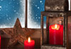  A rustic star and lantern, and three red candles sit on the sill of a window with snow falling gently outside. The words Christmas Hope and Peace are written at the top.