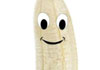 A partially peeled banana with a cartoon face. 