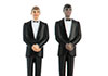 A wedding cake. The cake toppers are two tuxedo-wearing grooms.