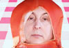 A man dressed in a hot dog costume. The name of this free funny ecard is Spiritual Birthday Wiener is written in the foreground. 