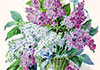 A vase, containing colorful hyacinth blossoms.