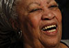 A black woman laughing jubilantly. 