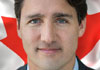 An image of Justin Trudeau, with the Canadian flag behind him. The ecard title Talking Trudeau is written around him.