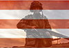 In this heartfelt ecard, a soldier in fatigues wakes toward the viewer. An image of red and white stripes is superimposed over him.